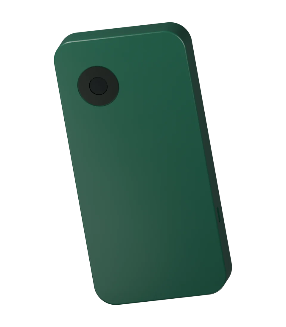 Forest-green FAMA rear view showing the recessed camera bezel and rounded compact enclosure